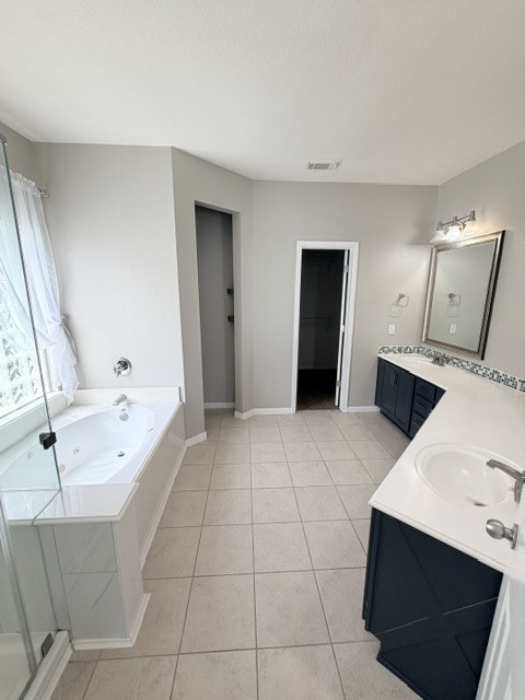 20030 Castlegreen Drive Spring, TX 77388 - Photo 12 of 23 a large bathroom with a sink a large mirror and bathtub