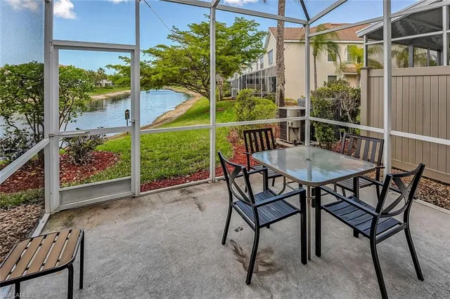 a view of a chairs and table in the patio