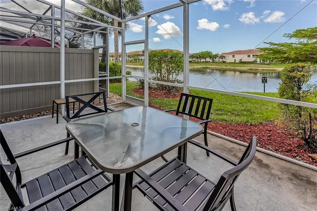a view of a chairs and table in the patio