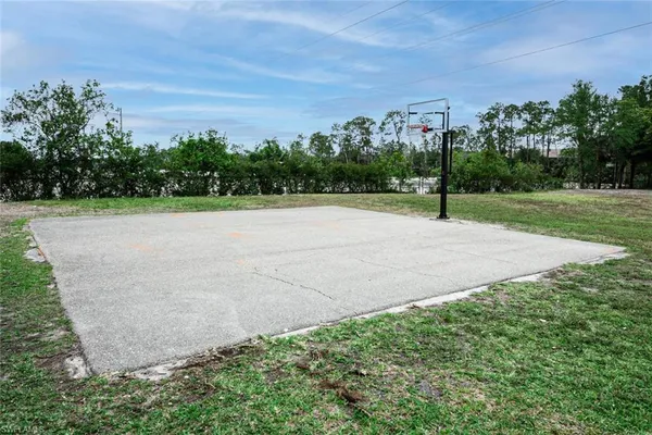 a view of an outdoor space and tennis court