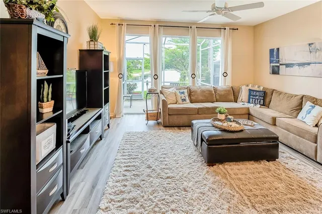 a living room with furniture fireplace and a flat screen tv