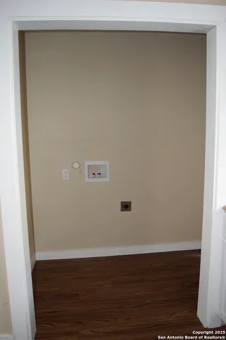 a kitchen with cabinets appliances and a window