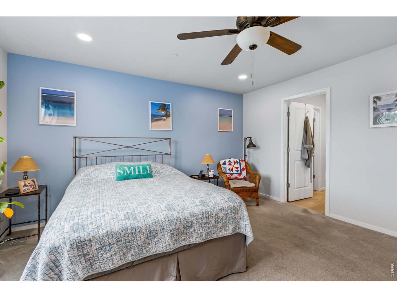 6609 4th St Road, Unit 4 Greeley, CO 80634 - Photo 21 of 41 a bedroom with a bed and a chandelier