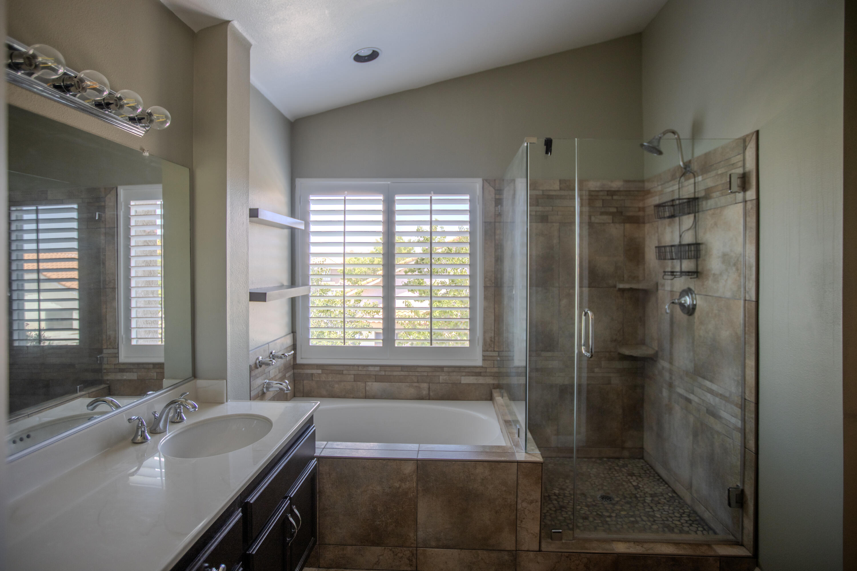 36852 Vía Del Rio Palmdale, CA 93550 - Photo 19 of 34 a bathroom with a tub sink and shower