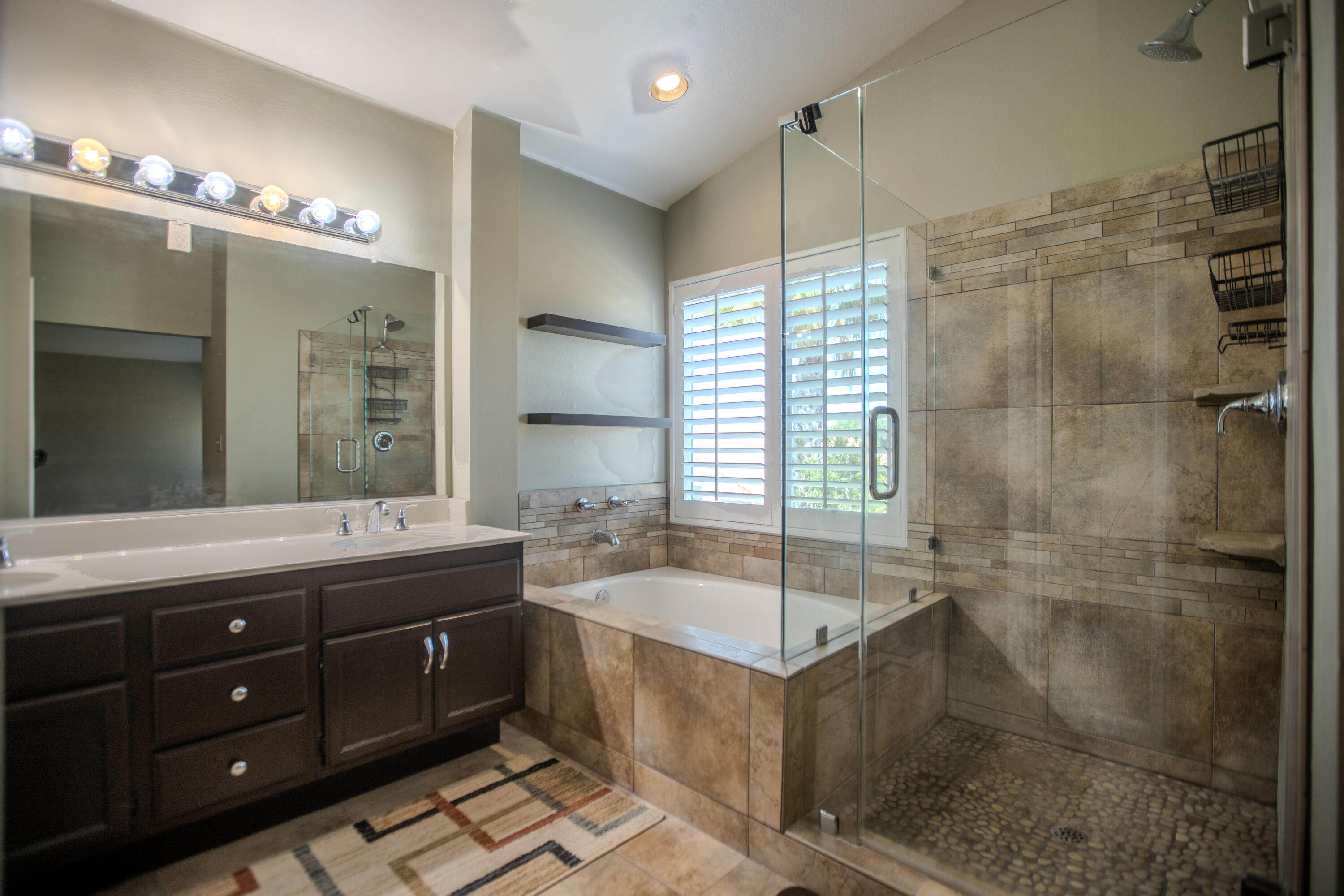 36852 Vía Del Rio Palmdale, CA 93550 - Photo 20 of 34 a bathroom with a tub sink shower and mirror