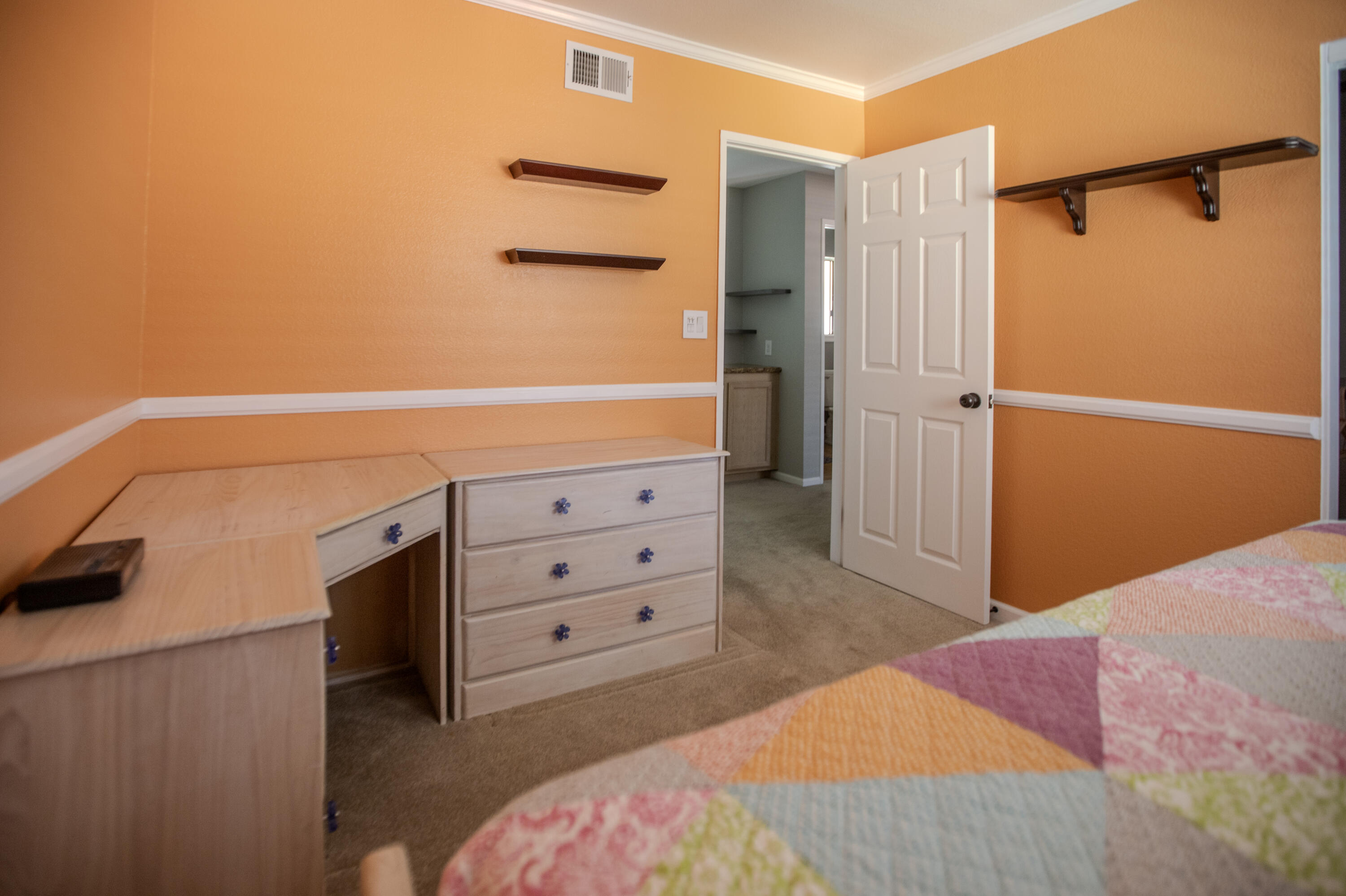 36852 Vía Del Rio Palmdale, CA 93550 - Photo 28 of 34 a bedroom with a bed and cabinets