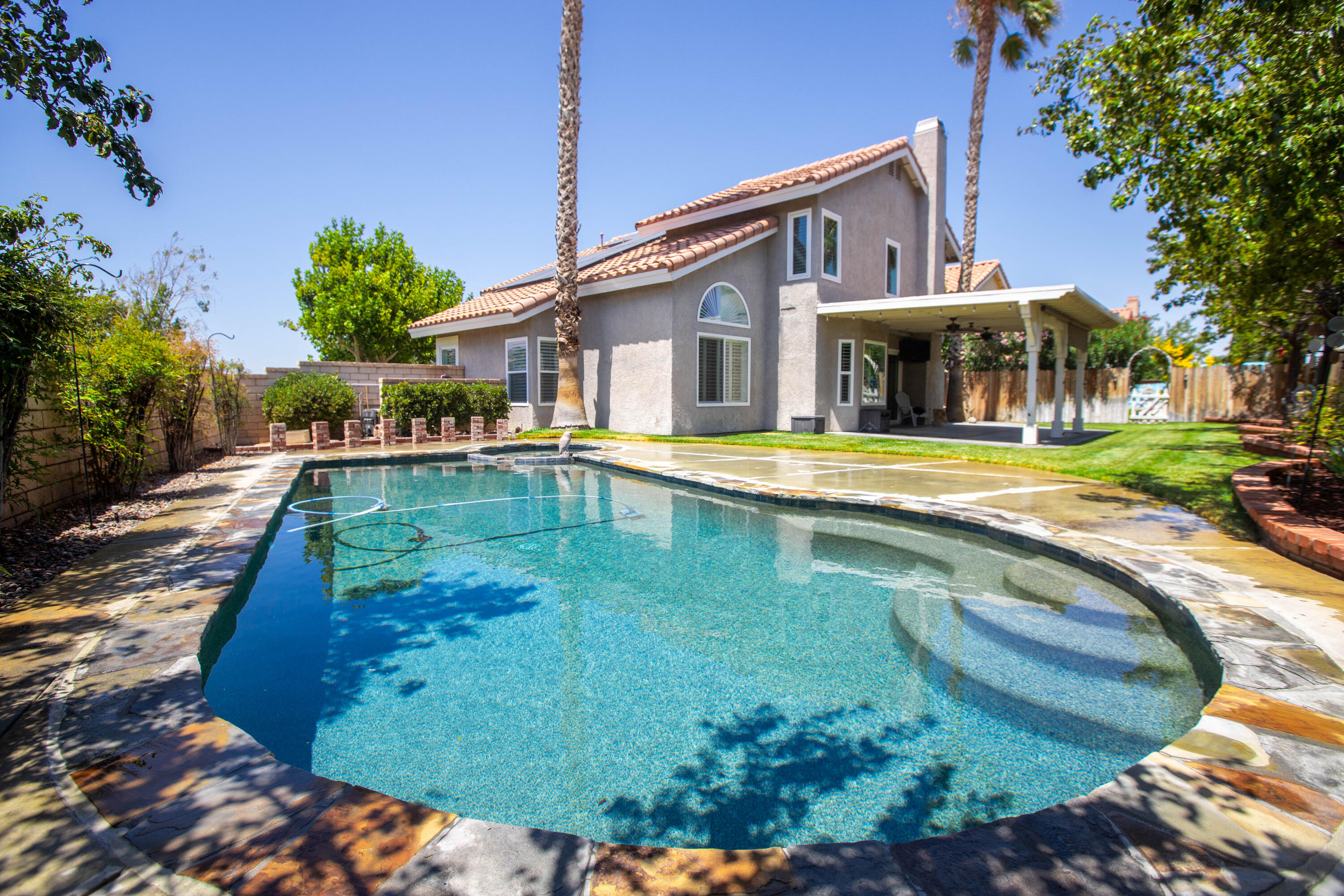 36852 Vía Del Rio Palmdale, CA 93550 - Photo 33 of 34 a view of a house with swimming pool