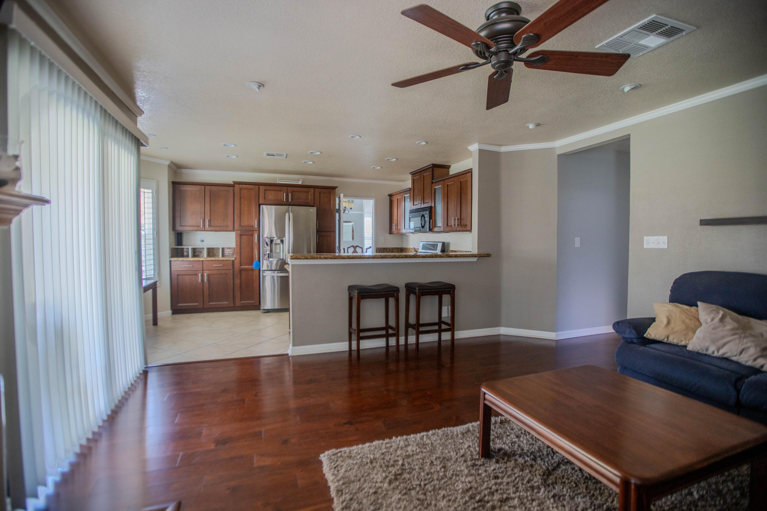 36852 Vía Del Rio Palmdale, CA 93550 - Photo 10 of 34 a living room with furniture and a kitchen view