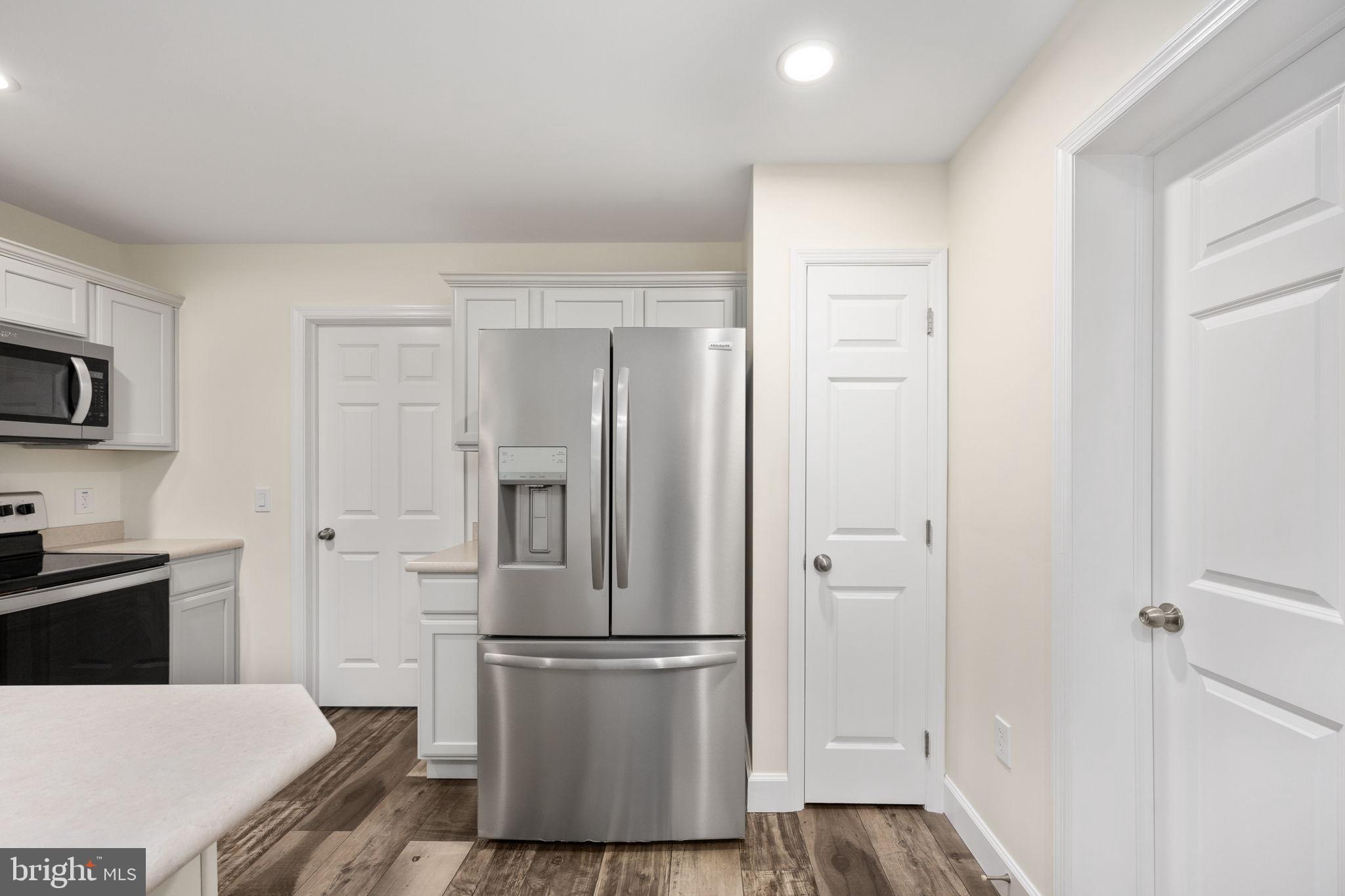300 River Oaks Road Center Cross, VA 22437 - Photo 20 of 39 Modern kitchen with sleek appliances.