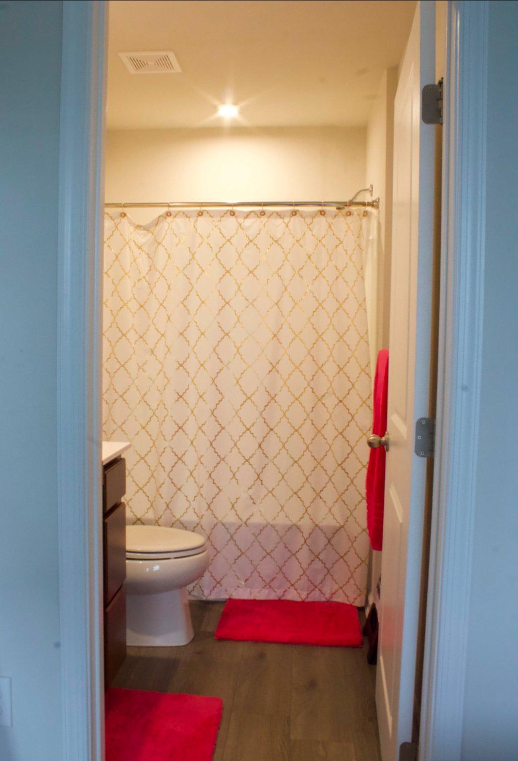 46 Mudstone Road Dover, DE 19904 - Photo 13 of 20 a bathroom with a toilet and a shower curtain