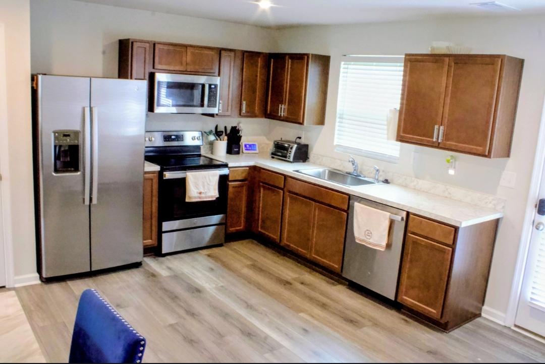 46 Mudstone Road Dover, DE 19904 - Photo 6 of 20 a kitchen with stainless steel appliances granite countertop a refrigerator stove and sink