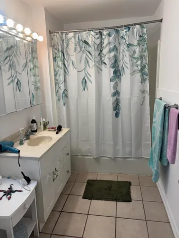 a bathroom with a sink and shower