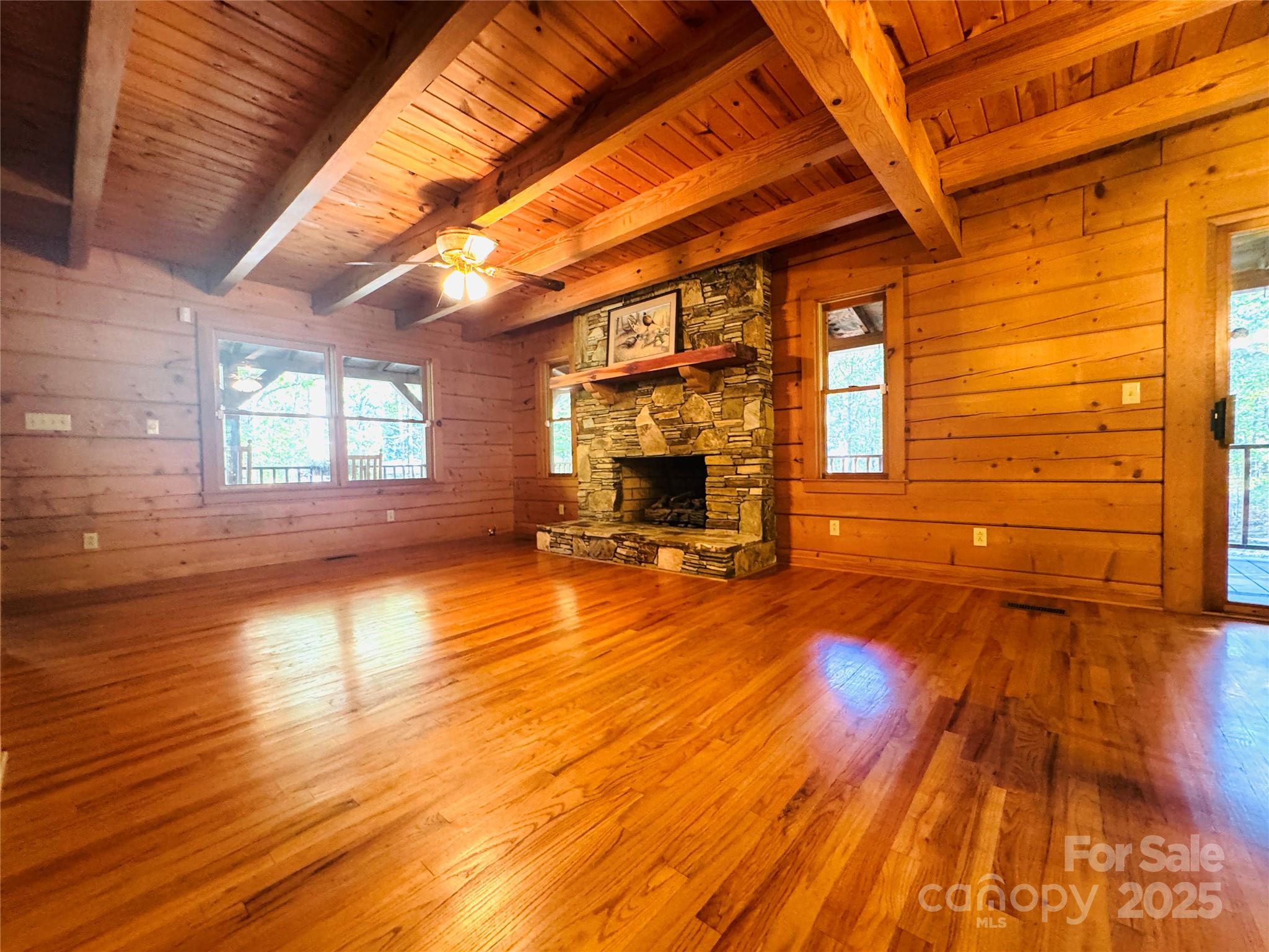 565 Barber Road Gold Hill, NC 28071 - Photo 14 of 42 a view of empty room with wooden floor and fan