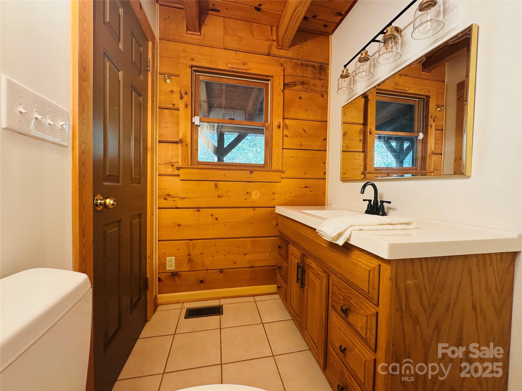 565 Barber Road Gold Hill, NC 28071 - Photo 18 of 42 a bathroom with a sink a mirror and a bathtub