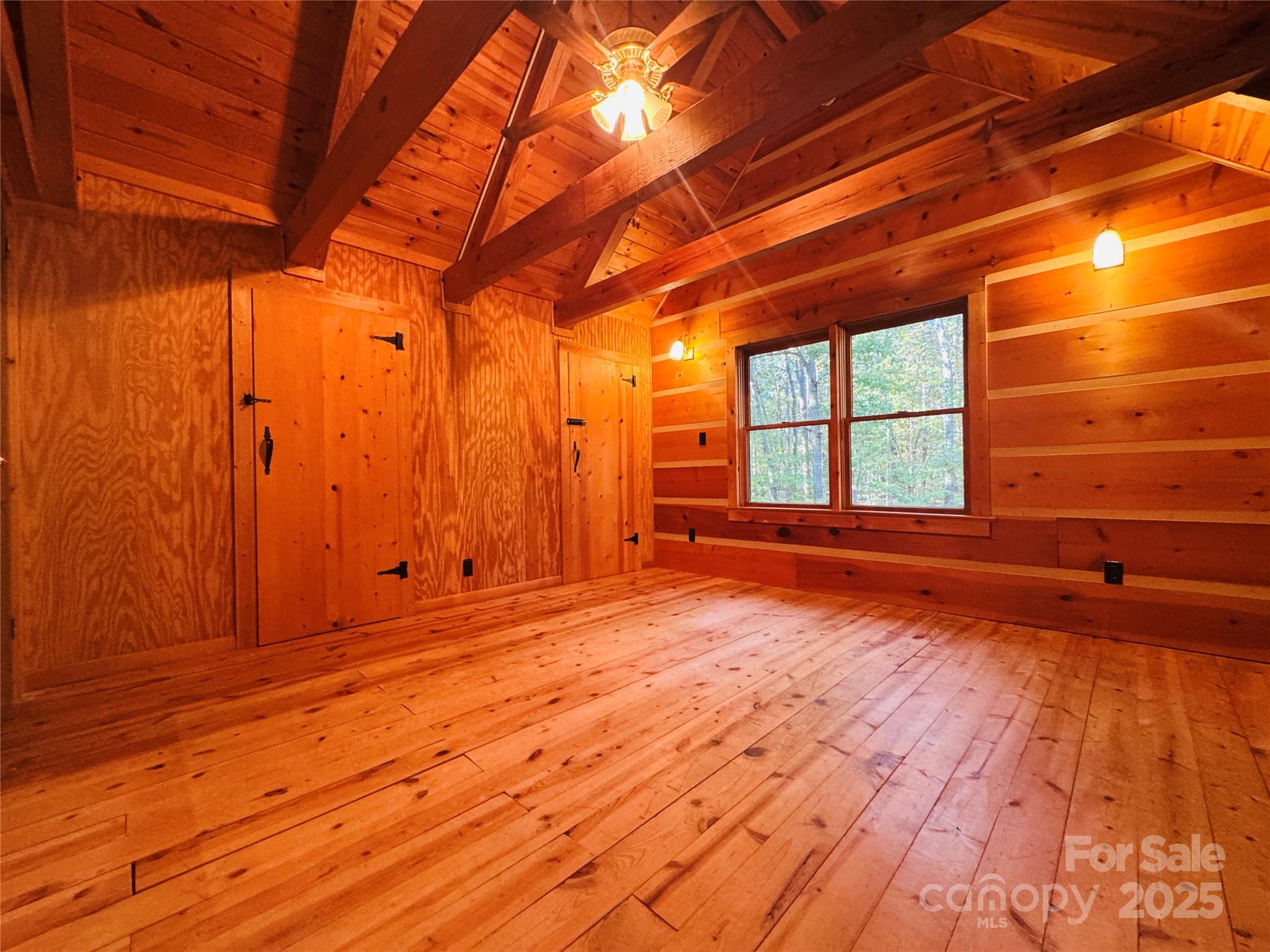 565 Barber Road Gold Hill, NC 28071 - Photo 25 of 42 a view of an empty room with wooden floor and a window