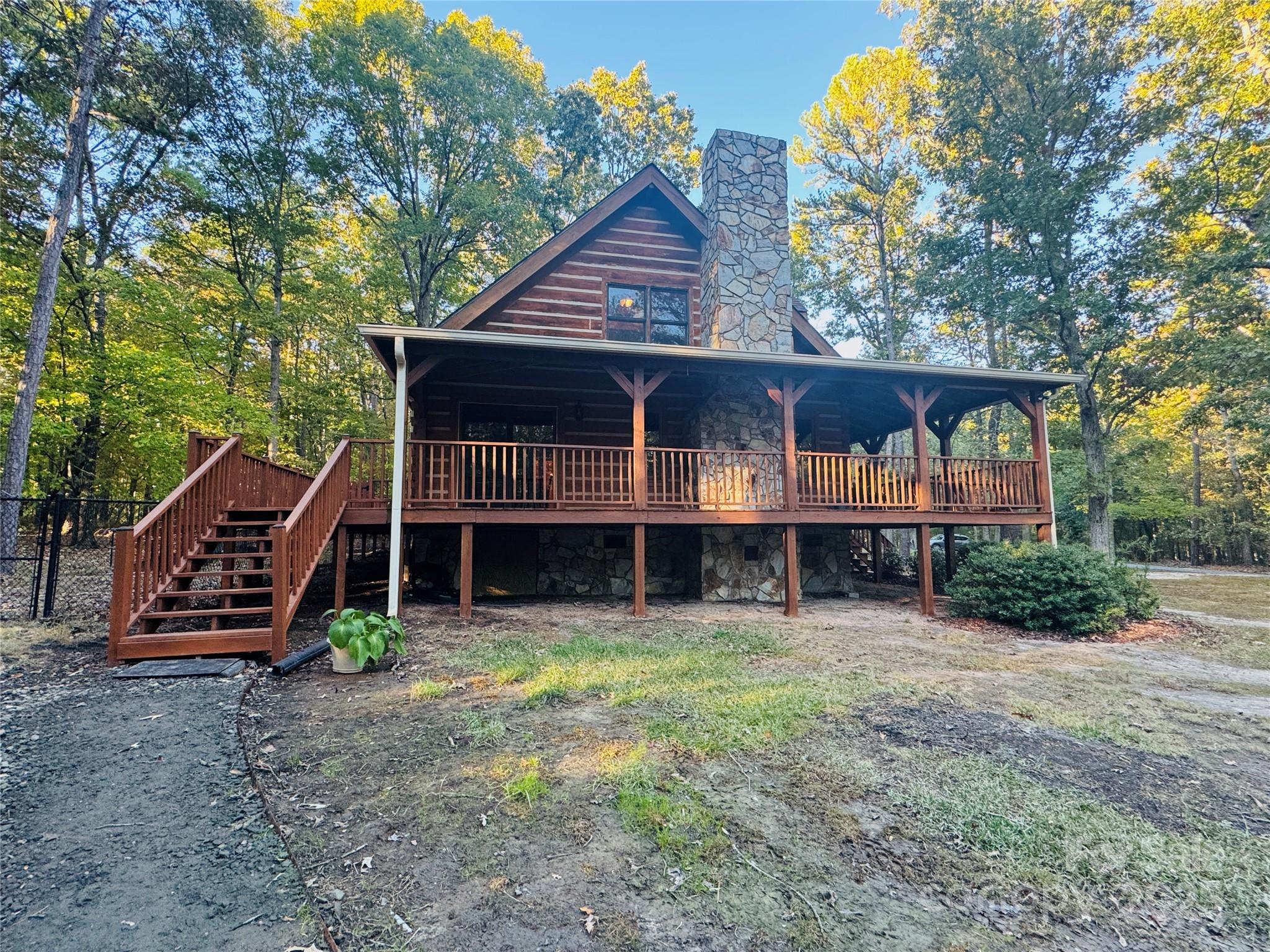 565 Barber Road Gold Hill, NC 28071 - Photo 3 of 42 a front view of a house with garden