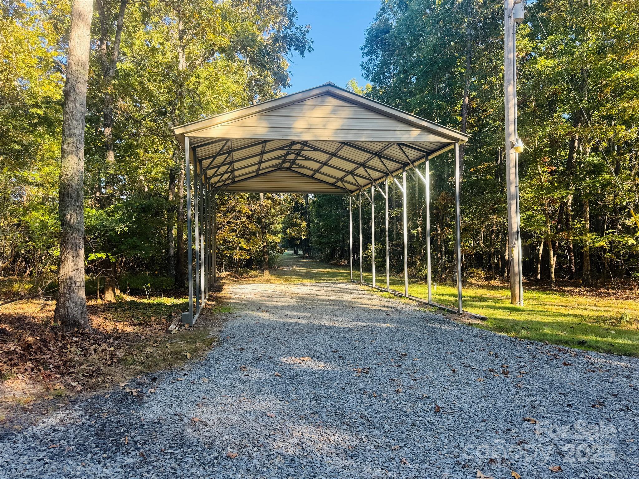 565 Barber Road Gold Hill, NC 28071 - Photo 32 of 42 a view of a house with a yard and swimming pool