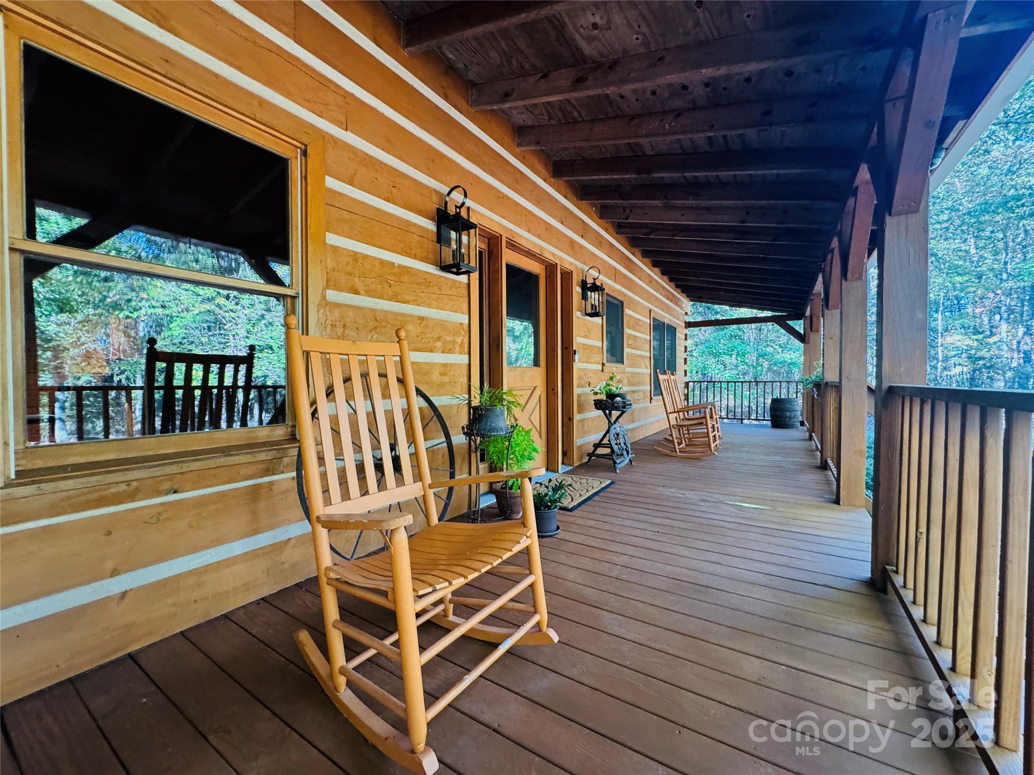 565 Barber Road Gold Hill, NC 28071 - Photo 39 of 42 a view of a patio with table and chairs with wooden floor and fence