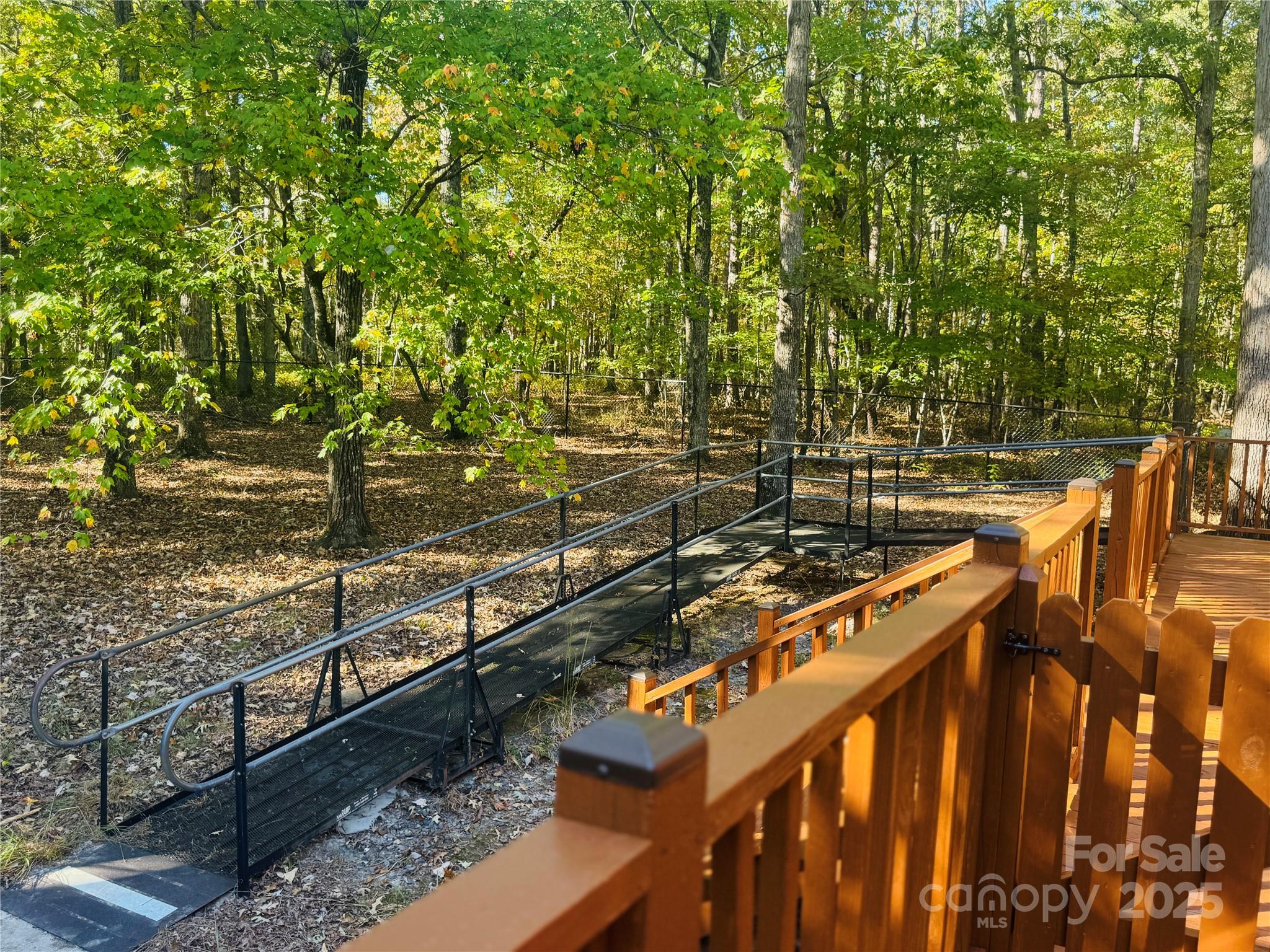 565 Barber Road Gold Hill, NC 28071 - Photo 42 of 42 a view of a wooden deck with a bench