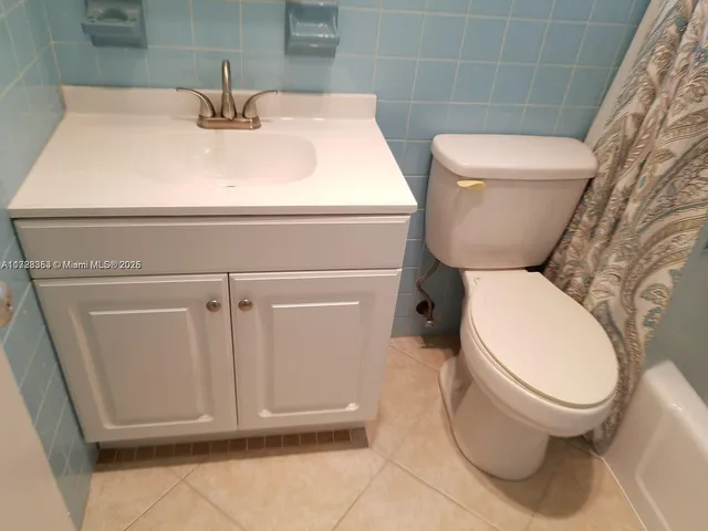 a bathroom with a toilet and a sink