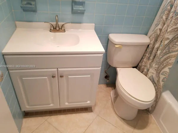 a bathroom with a toilet and a sink