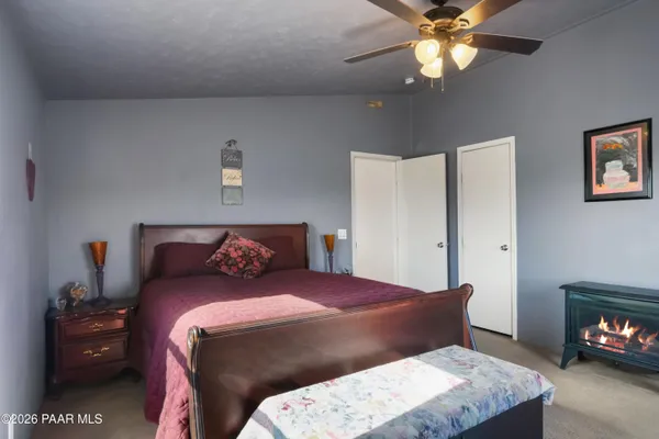 a bedroom with a bed and a television