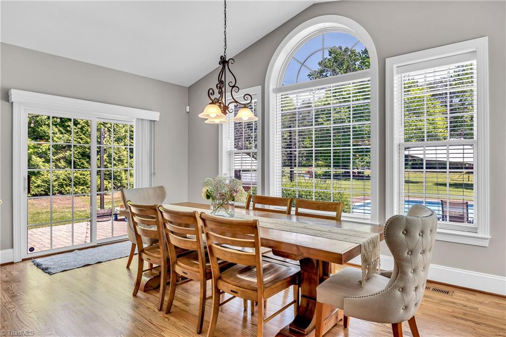 6410 Ashton Park Drive Oak Ridge, NC 27310 - Photo 16 of 49 Breakfast room with vaulted ceiling.