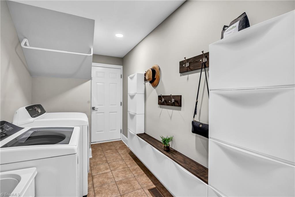 6410 Ashton Park Drive Oak Ridge, NC 27310 - Photo 21 of 49 Laundry room with tile floor.