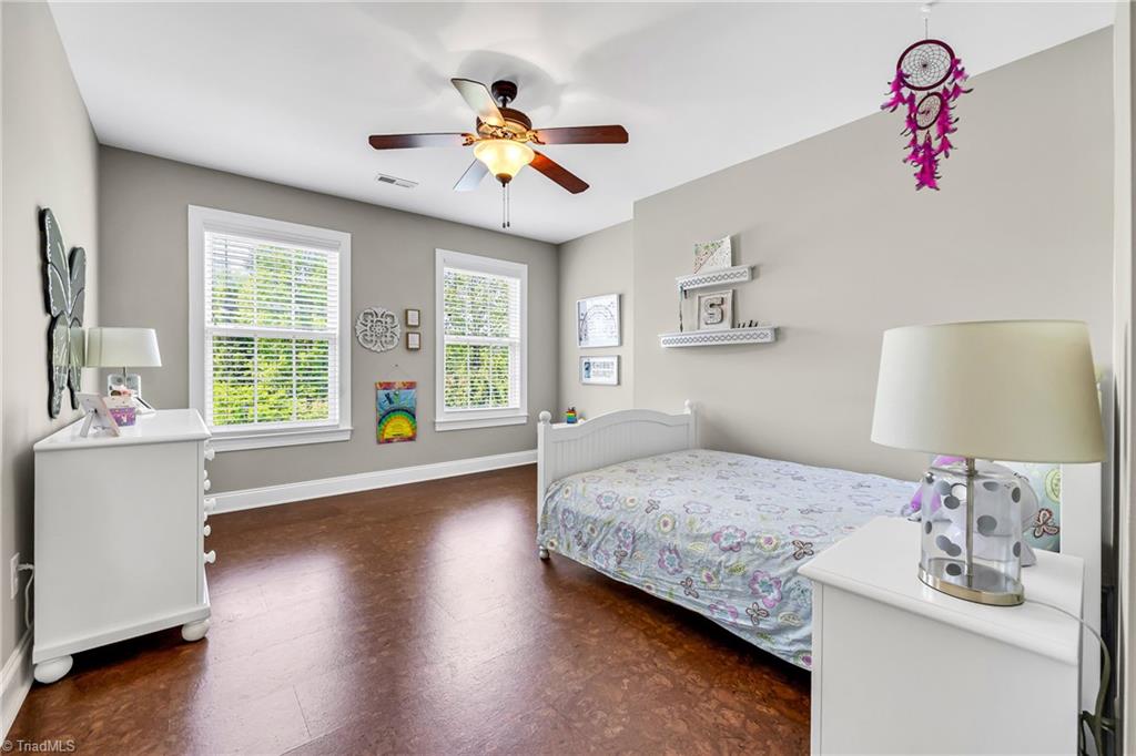 6410 Ashton Park Drive Oak Ridge, NC 27310 - Photo 35 of 49 Bedroom with cork flooring.