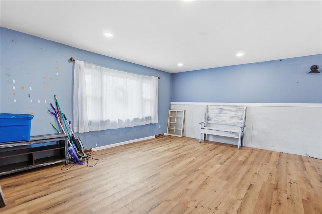 290 Ginghamsburg Road Tipp City, OH 45371 - Photo 7 of 49 This bright room features durable flooring and ample natural light, creating a welcoming atmosphere.