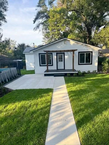 a front view of a house with yard