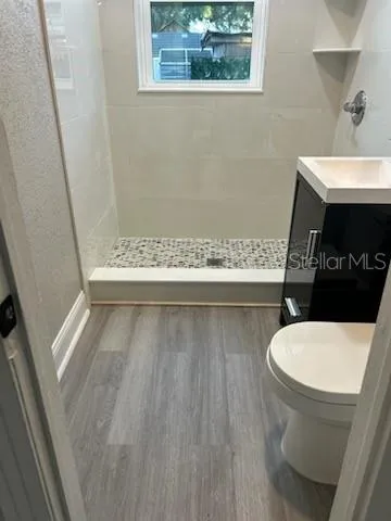 a bathroom with a toilet and a sink