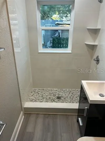 a bathroom with a sink and a window