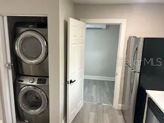 a view of a hallway with washer and dryer
