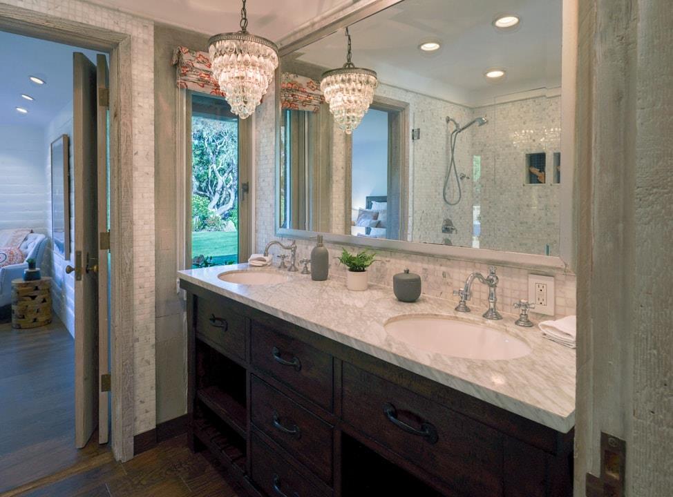 1340 Jacks Road Monterey, CA 93940 - Photo 16 of 37 a bathroom with double vanity sinks a vanity a lamp and a mirror