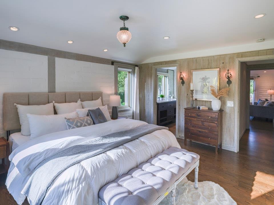 1340 Jacks Road Monterey, CA 93940 - Photo 18 of 37 a spacious bedroom with a bed and wooden floor
