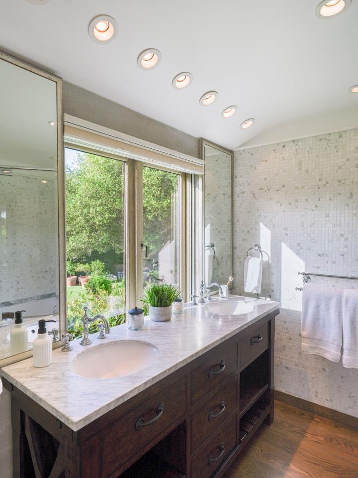 1340 Jacks Road Monterey, CA 93940 - Photo 19 of 37 a bathroom with a granite countertop sink and a large mirror