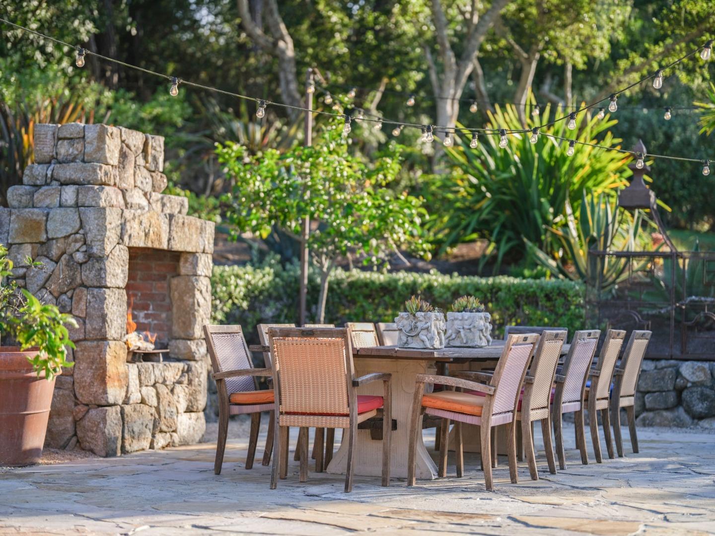 1340 Jacks Road Monterey, CA 93940 - Photo 26 of 37 a backyard of a house with table and chairs