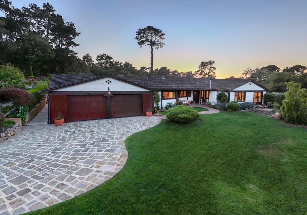 1340 Jacks Road Monterey, CA 93940 - Photo 3 of 37 a front view of a house with a garden and yard