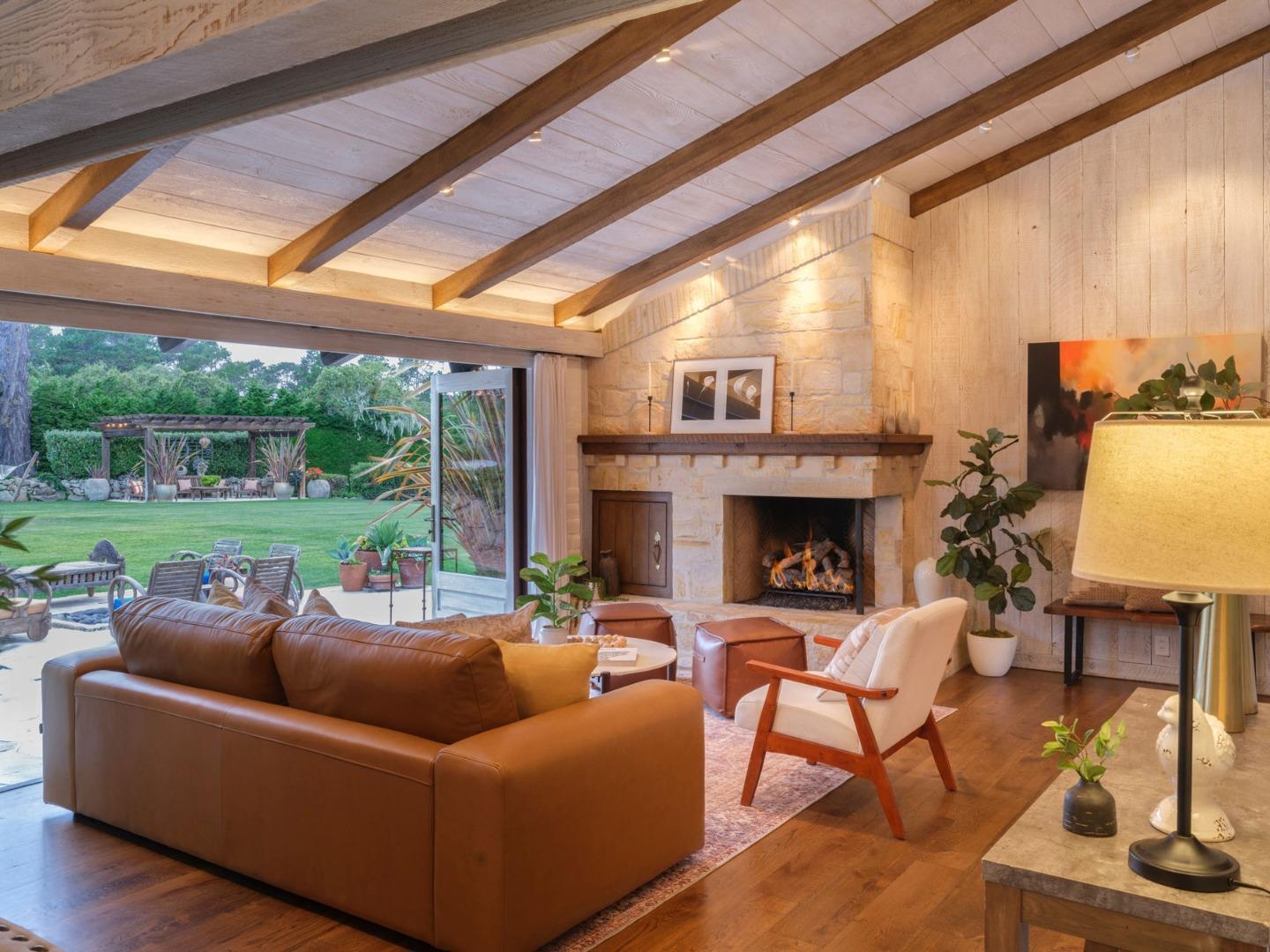 1340 Jacks Road Monterey, CA 93940 - Photo 9 of 37 a living room with furniture a fireplace and a floor to ceiling window