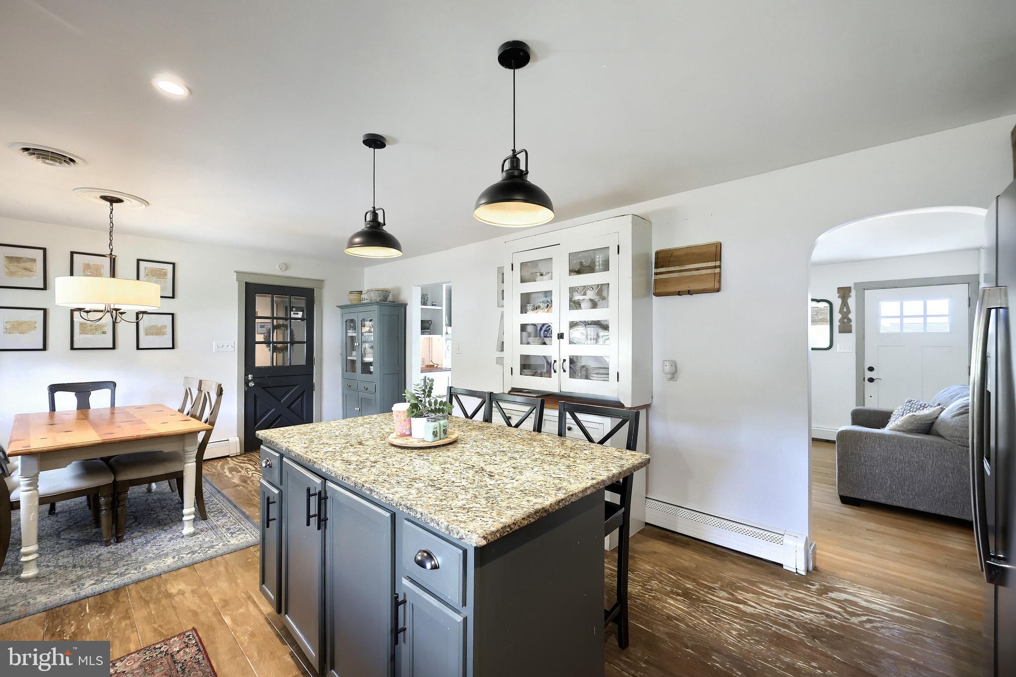 492 Bollinger Road Littlestown, PA 17340 - Photo 16 of 47 a view of kitchen island with granite countertop living room