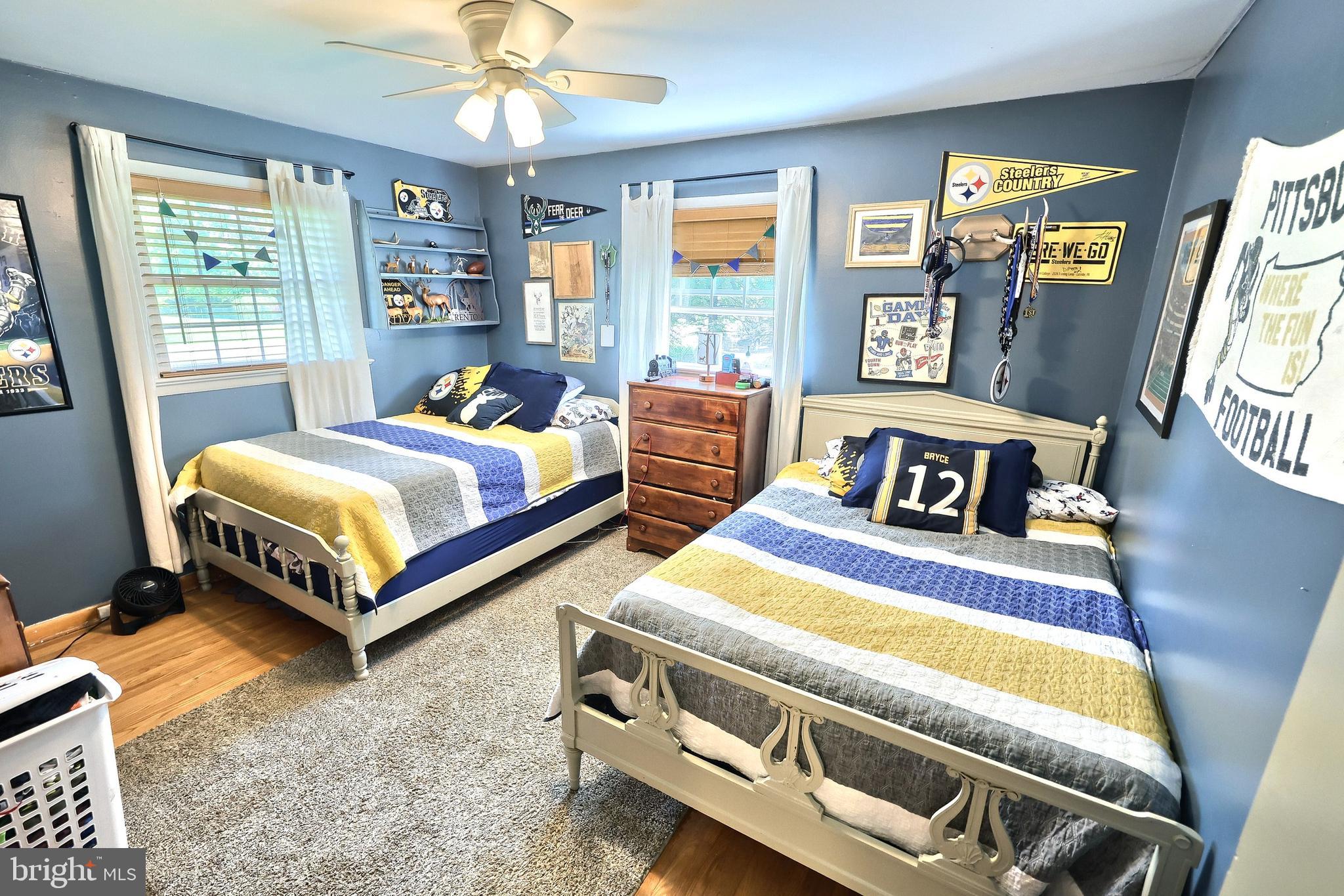 492 Bollinger Road Littlestown, PA 17340 - Photo 23 of 47 a bedroom with two beds and a chandelier