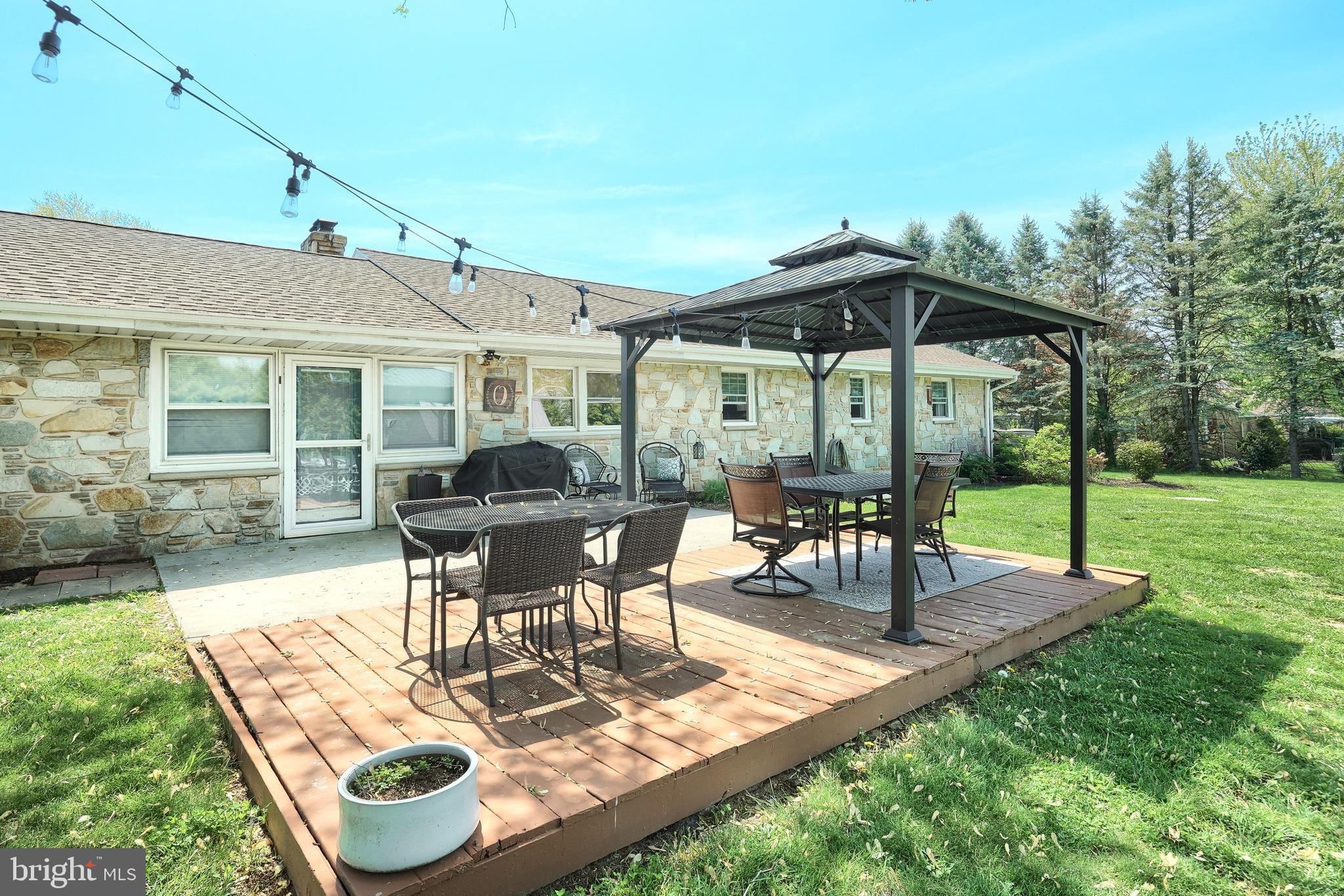 492 Bollinger Road Littlestown, PA 17340 - Photo 37 of 47 a table and chairs in the garden