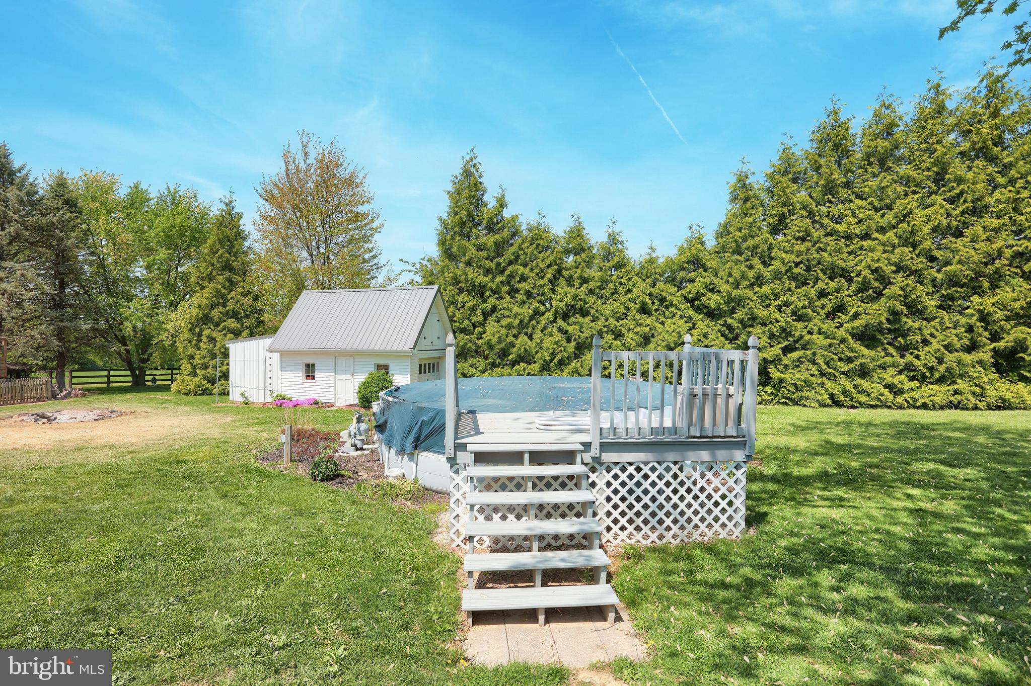 492 Bollinger Road Littlestown, PA 17340 - Photo 38 of 47 a view of a chair and table in the garden