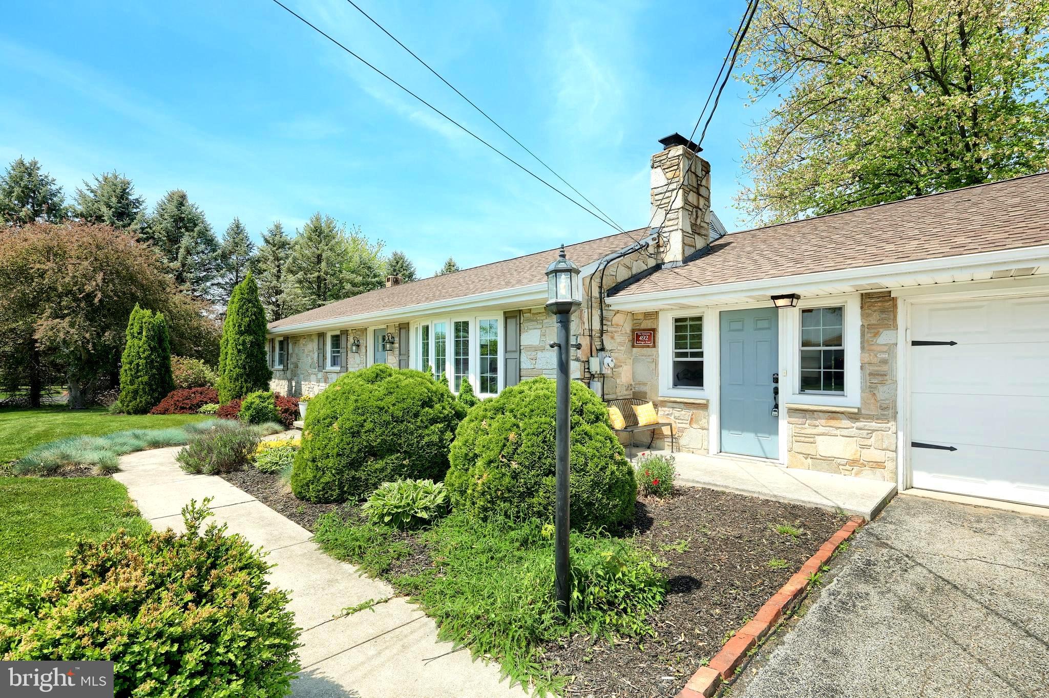 492 Bollinger Road Littlestown, PA 17340 - Photo 5 of 47 a front view of a house with garden