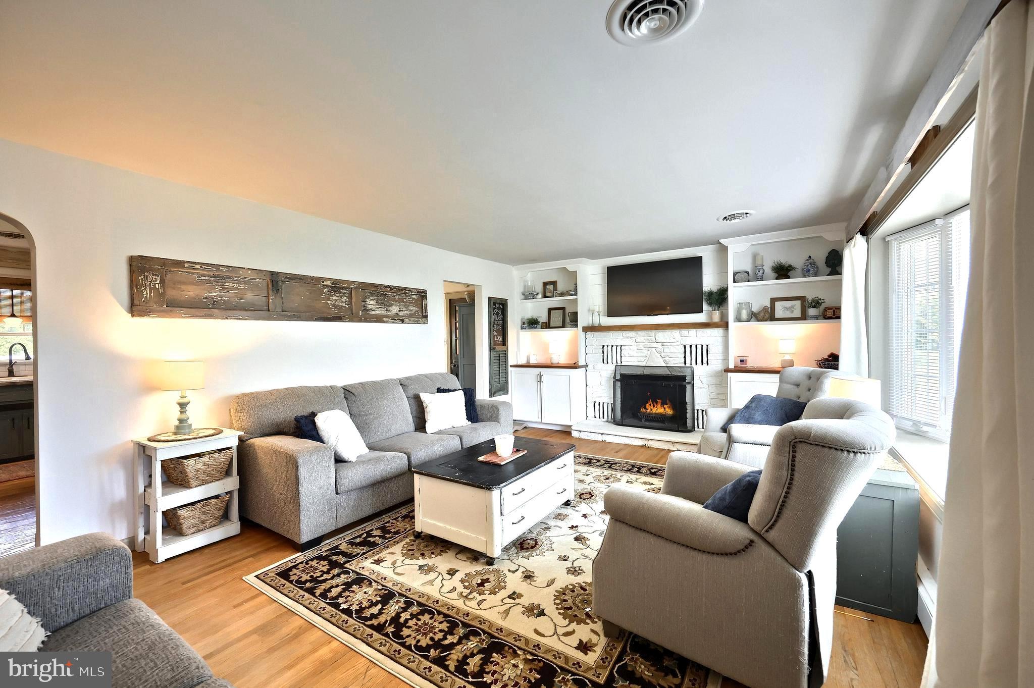 492 Bollinger Road Littlestown, PA 17340 - Photo 10 of 47 a living room with furniture or fireplace and a flat screen tv