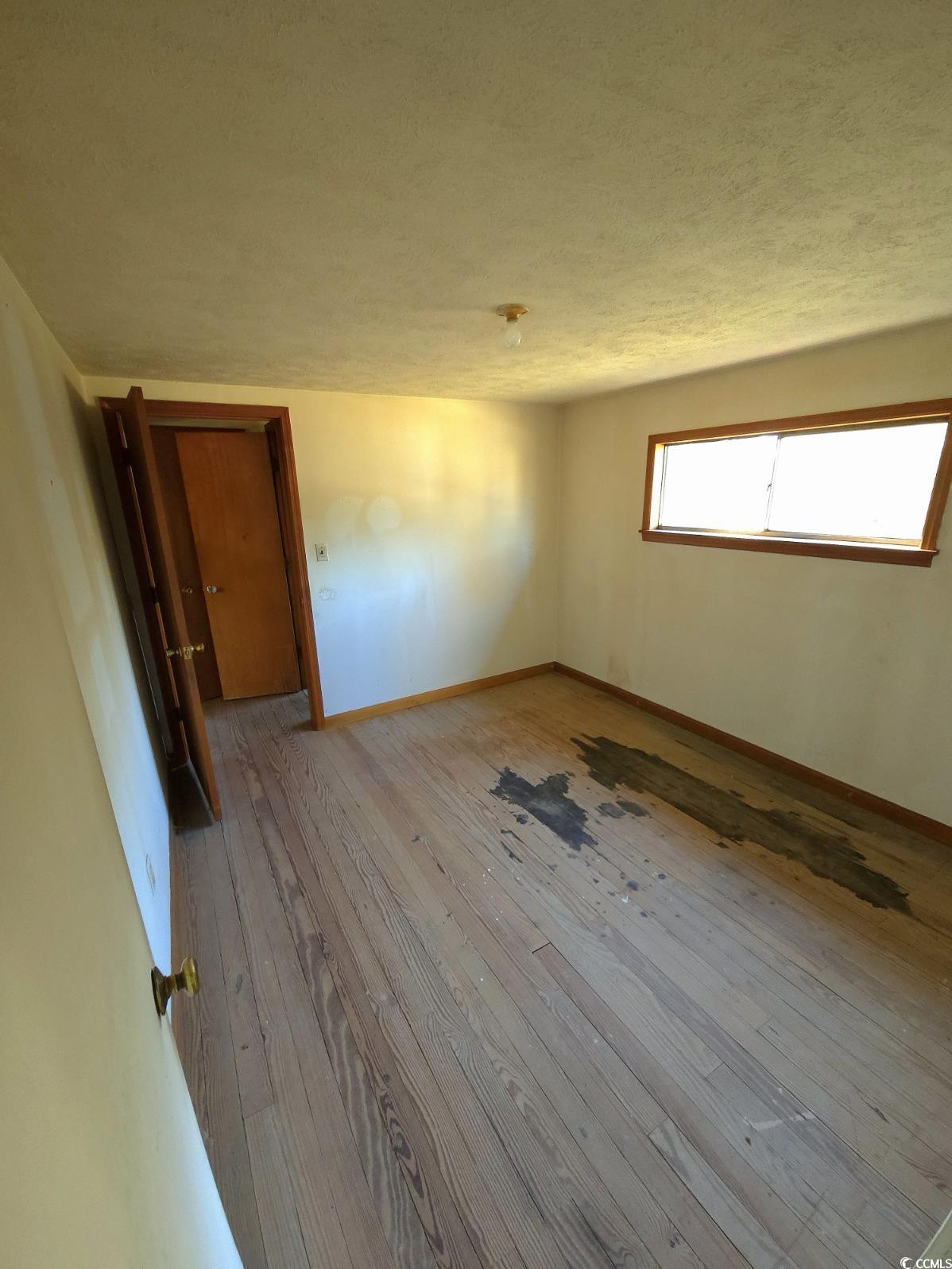 150 Landmark Road Conway, SC 29527 - Photo 13 of 35 Unfurnished room with a textured ceiling and hardwood / wood-style floors