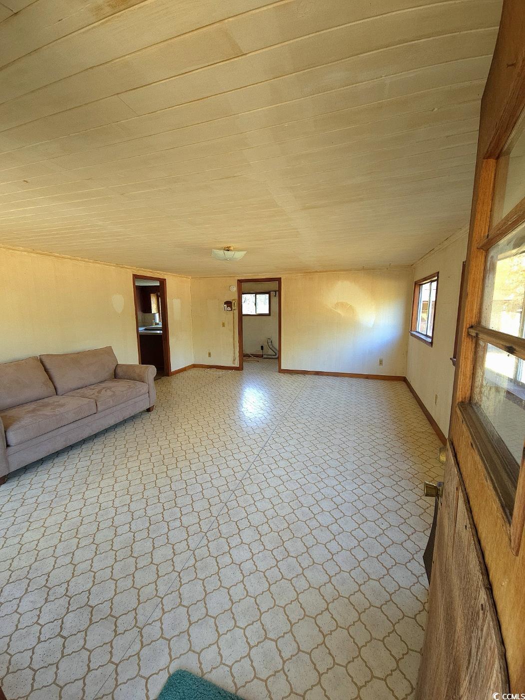 150 Landmark Road Conway, SC 29527 - Photo 2 of 35 Unfurnished living room featuring tile patterned floors and baseboards