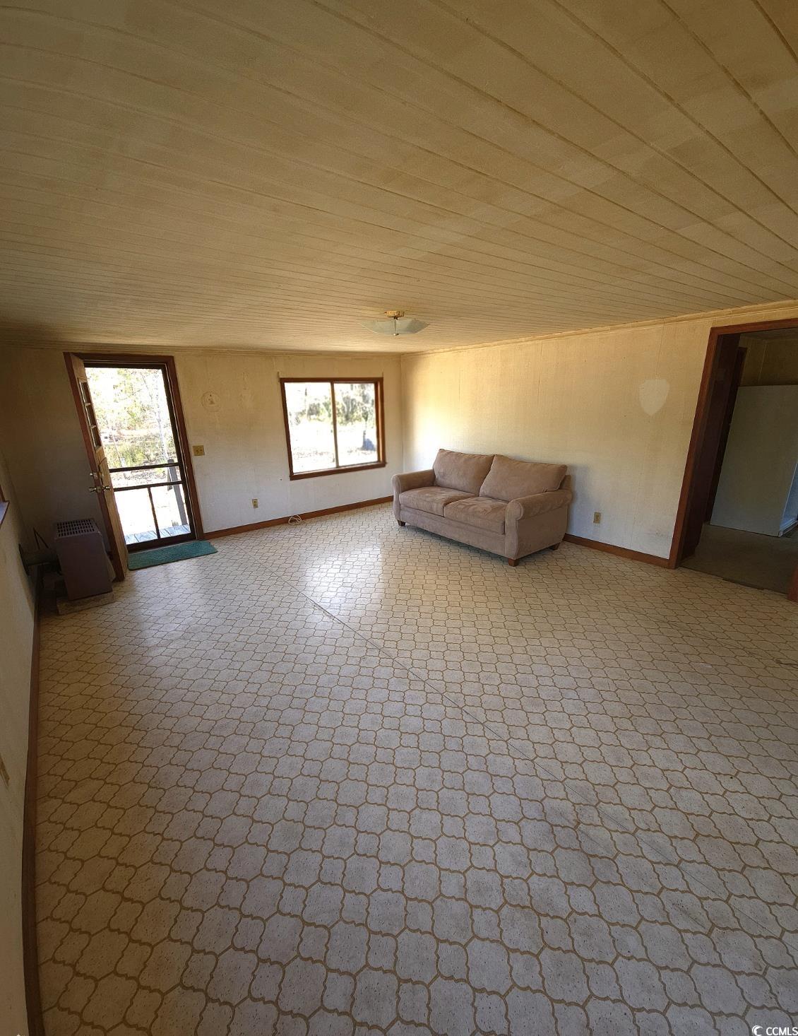 150 Landmark Road Conway, SC 29527 - Photo 3 of 35 Unfurnished living room with baseboards