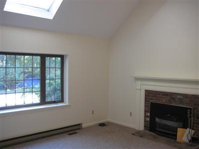 136 Ebenezer Road Osterville, MA 02655 - Photo 3 of 10 a living room with a fireplace